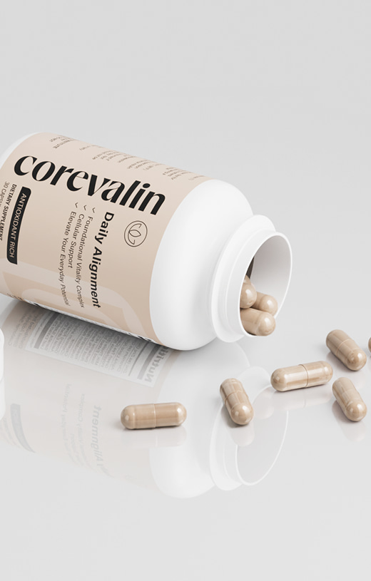 A Corevalin bottle on its side with several beige capsules beside it